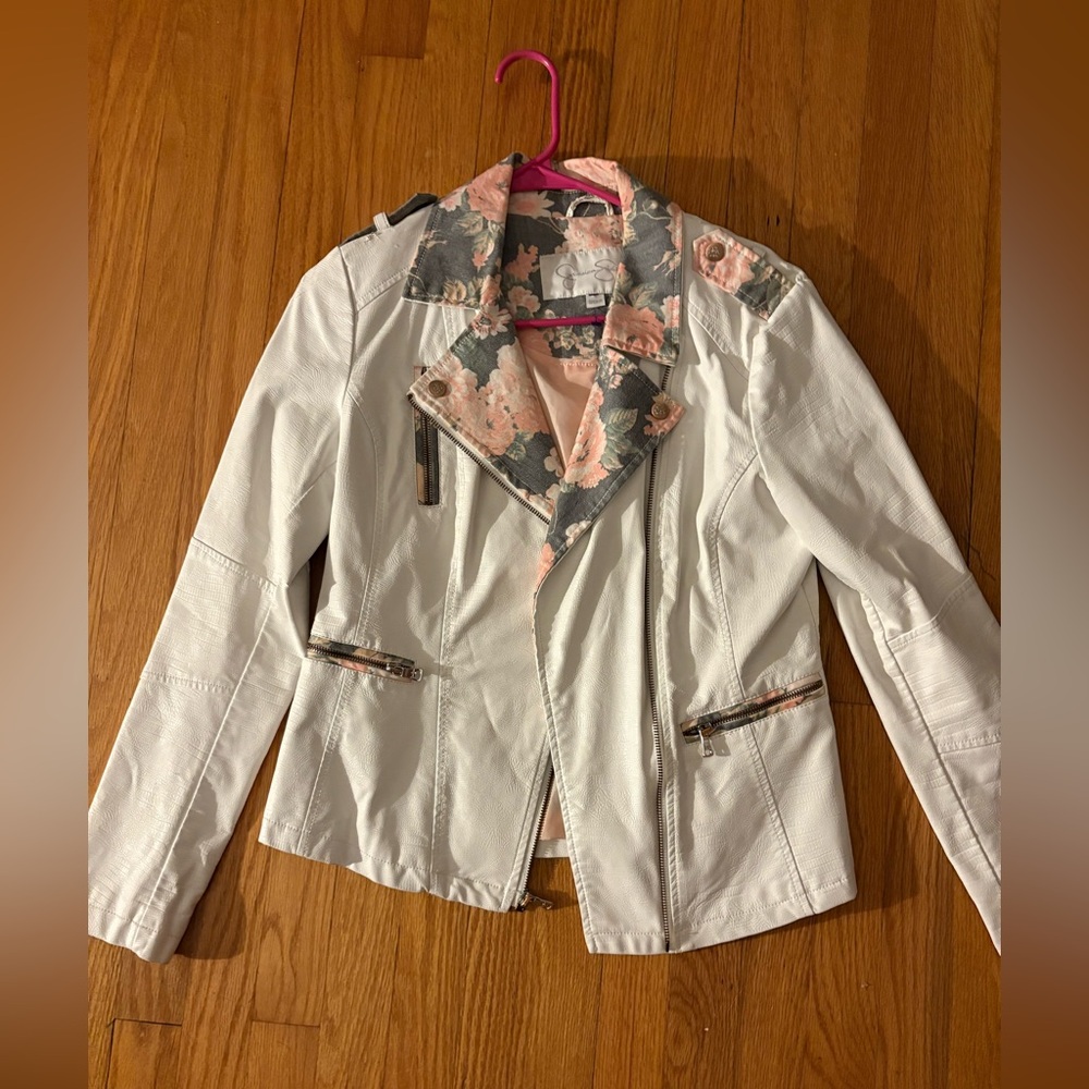 Jessica Simpson white leather jacket with floral detailing.
